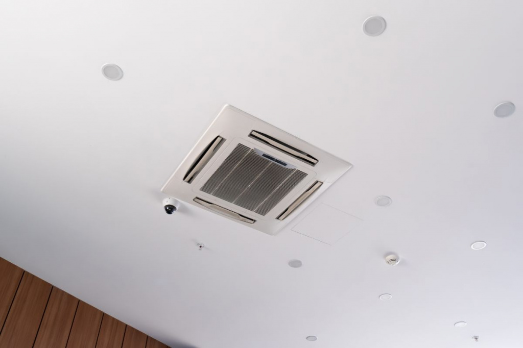 Modern-ceiling-cassette-air-conditioning-system-with-video-surveillance-camera-ceiling-spotlights.jpg